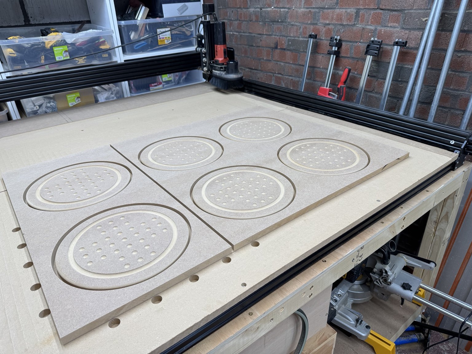 Multiple CNC-routed solitaire boards nested in a sheet before separation